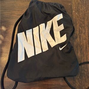 Nike Black Backpack with Iconic Logo and Drawstring Closure